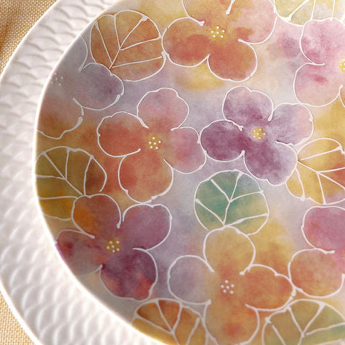 Watercolor Wildflower salad plate styled on a table with gold flatware, fruit, and yellow ranunculus.