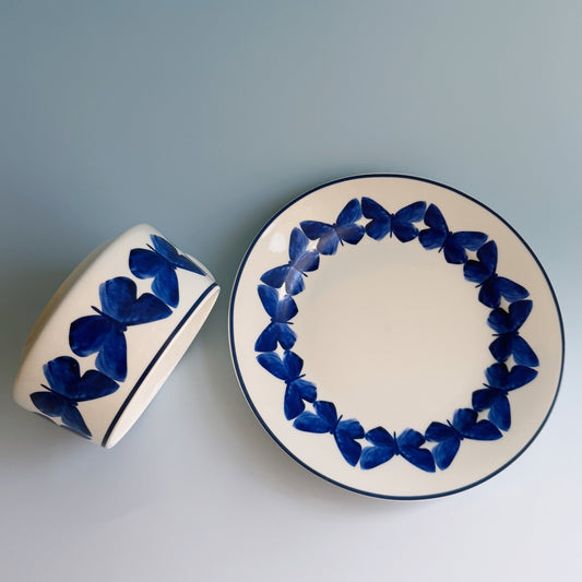 Adonis Blue Butterfly cup and saucer with blue butterfly border on white, viewed from above.