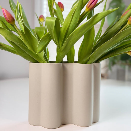 Scalloped ceramic vase with sculpted scalloped silhouette in matte finish