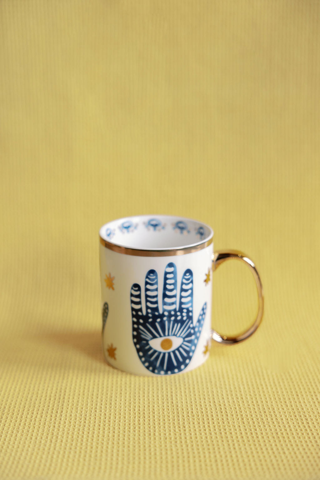 Mystic porcelain gilded collection with cobalt blue evil eye Nazar and Hamsa hand motifs and gold rim