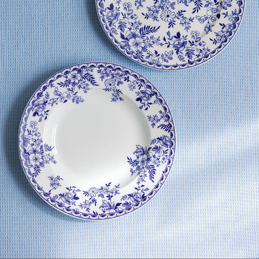 blue floral patterned salad plate on light blue background
