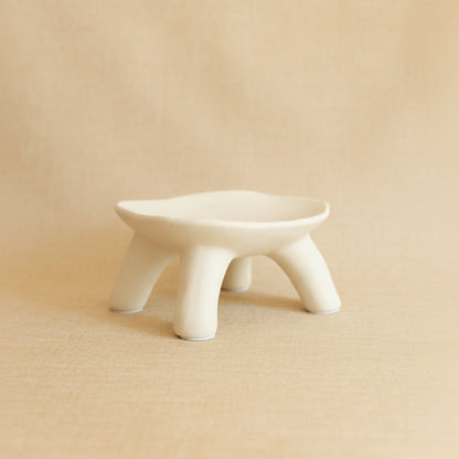 Light cream ceramic dish on a beige background