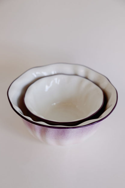 Two lavender ombre ruffle salad bowls nested, scalloped rims with deep purple edge fading to white.