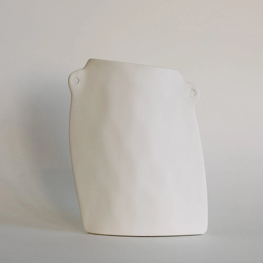 White asymmetrical pocket ceramic bud vase with flat slanted body and two small pierced side loops