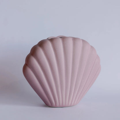Ceramic seashell bud vase with sculpted seashell silhouette for single stems