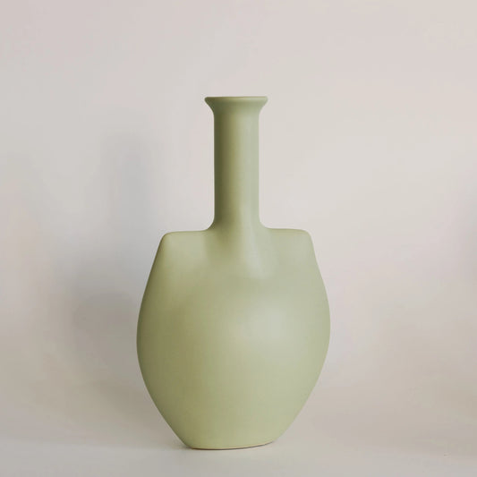 Sage green ceramic trowel bud vase with rounded body and tall narrow flared neck, front view