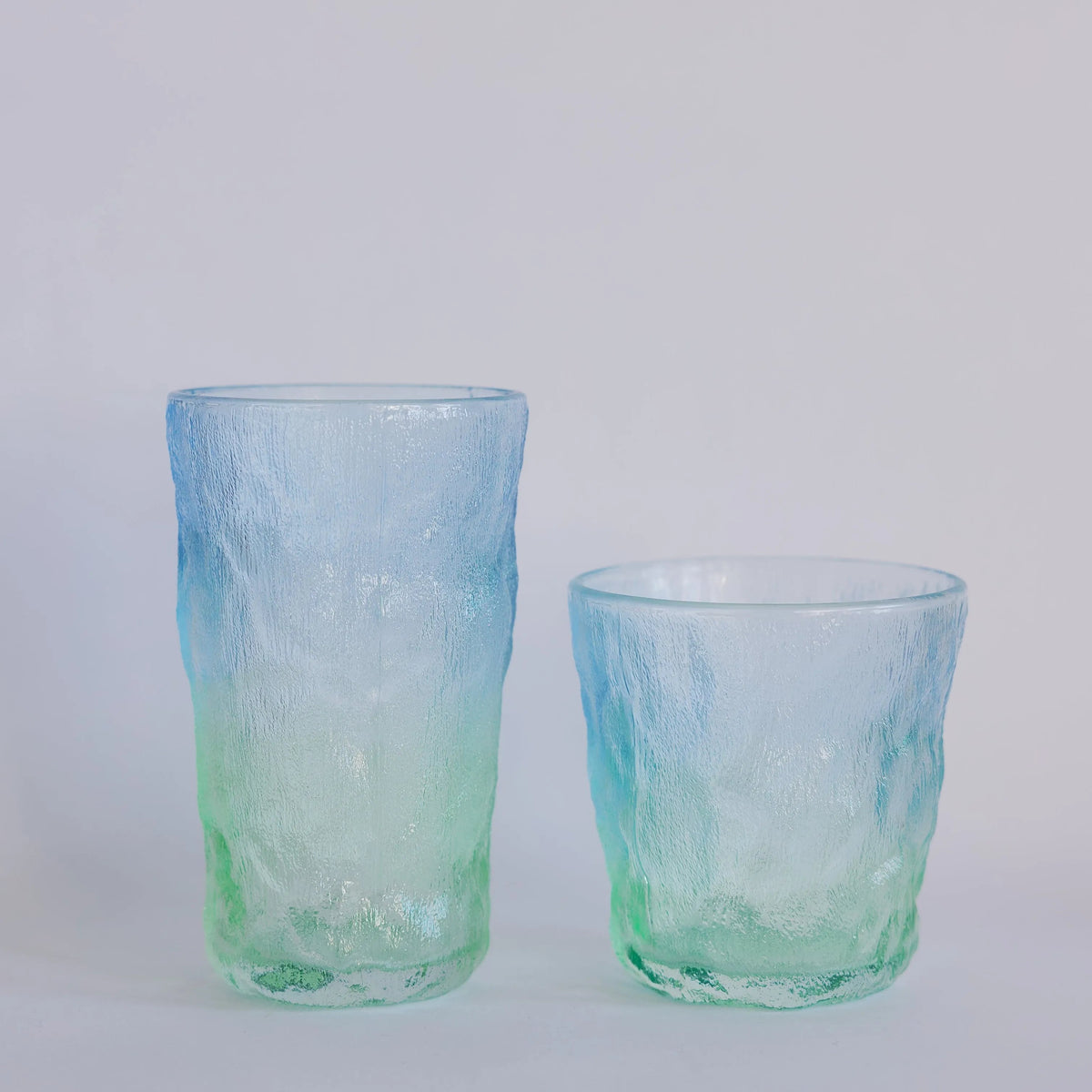 Coastal Hues glassware set of two, tall and short tumblers in blue-to-green ombre with crinkled texture
