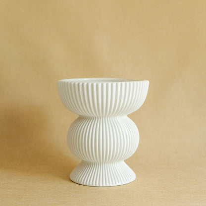 Fluted Column ceramic vase with vertical ribbed texture and architectural silhouette