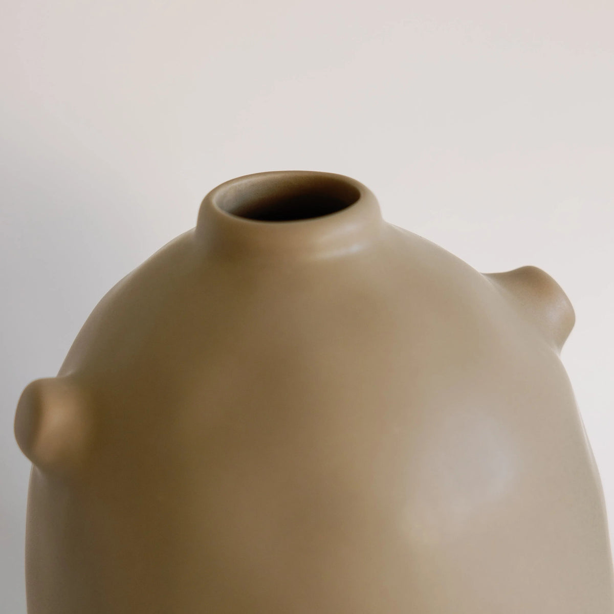 Close-up of taupe Kiln ceramic vase neck and narrow opening, showing small rounded shoulder nub detail
