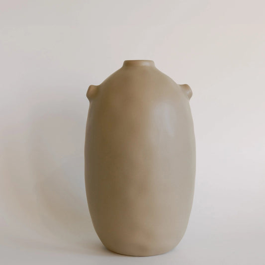 Single taupe Kiln ceramic vase, tall rounded body with narrow neck and two small side nubs, front view