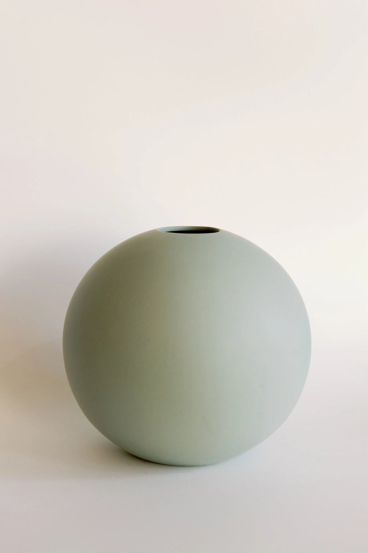 Large orb ceramic vase in sage green, big round sphere shape with small top opening and matte surface