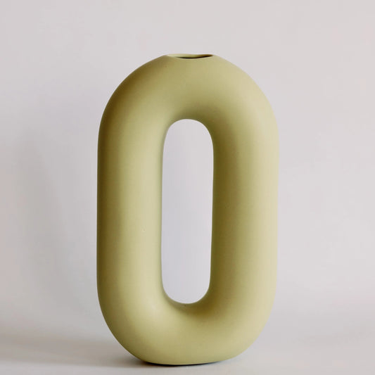 Olive green oval loop bud vase with elongated open center and small top opening, matte ceramic front view