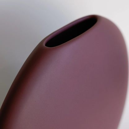 Luna ceramic vase close-up of plum matte surface and narrow oval mouth opening at the top