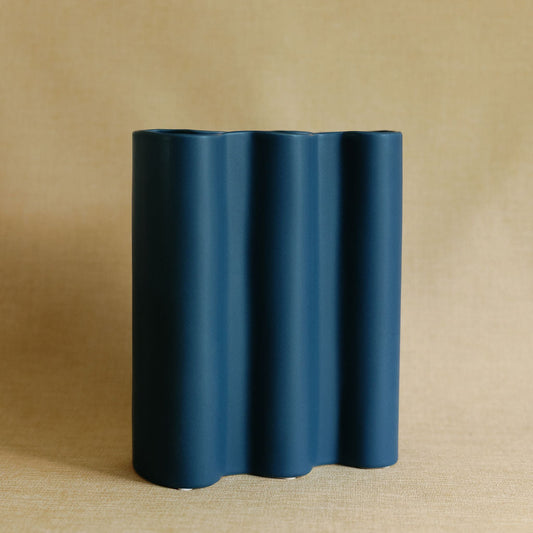 Cobalt blue fluted ceramic flower vase with vertical ribbed texture