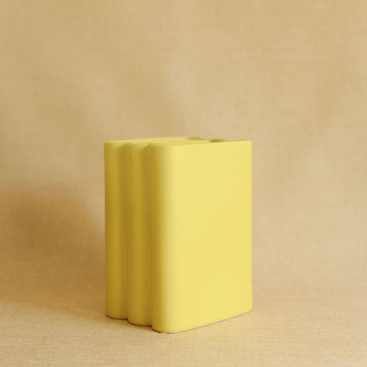 Yellow rectangular block on a beige background