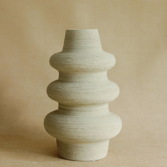 Mud Cocoon ceramic vase with organic earthy texture and rounded cocoon silhouette