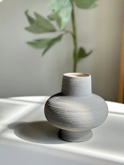 Nesting ceramic vase with sculpted nested rings silhouette in matte finish