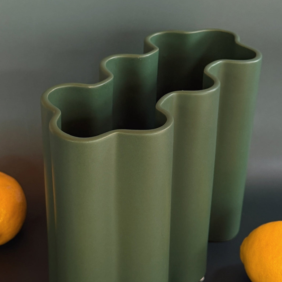 Ripple ceramic vase with wavy rippled surface texture in modern matte finish