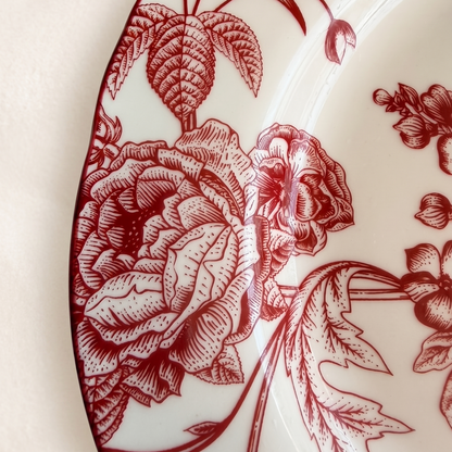 red and white floral salad plate on a bright cream background