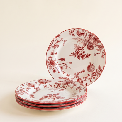 red and white floral plates against a bright cream background
