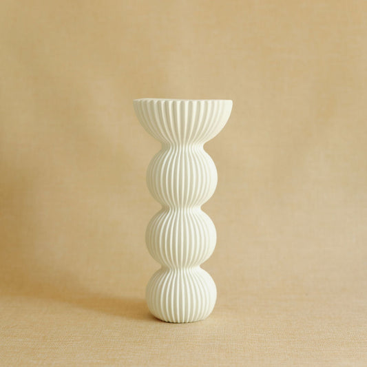 Pleated Column ceramic vase with sculpted pleated texture and tall slender silhouette