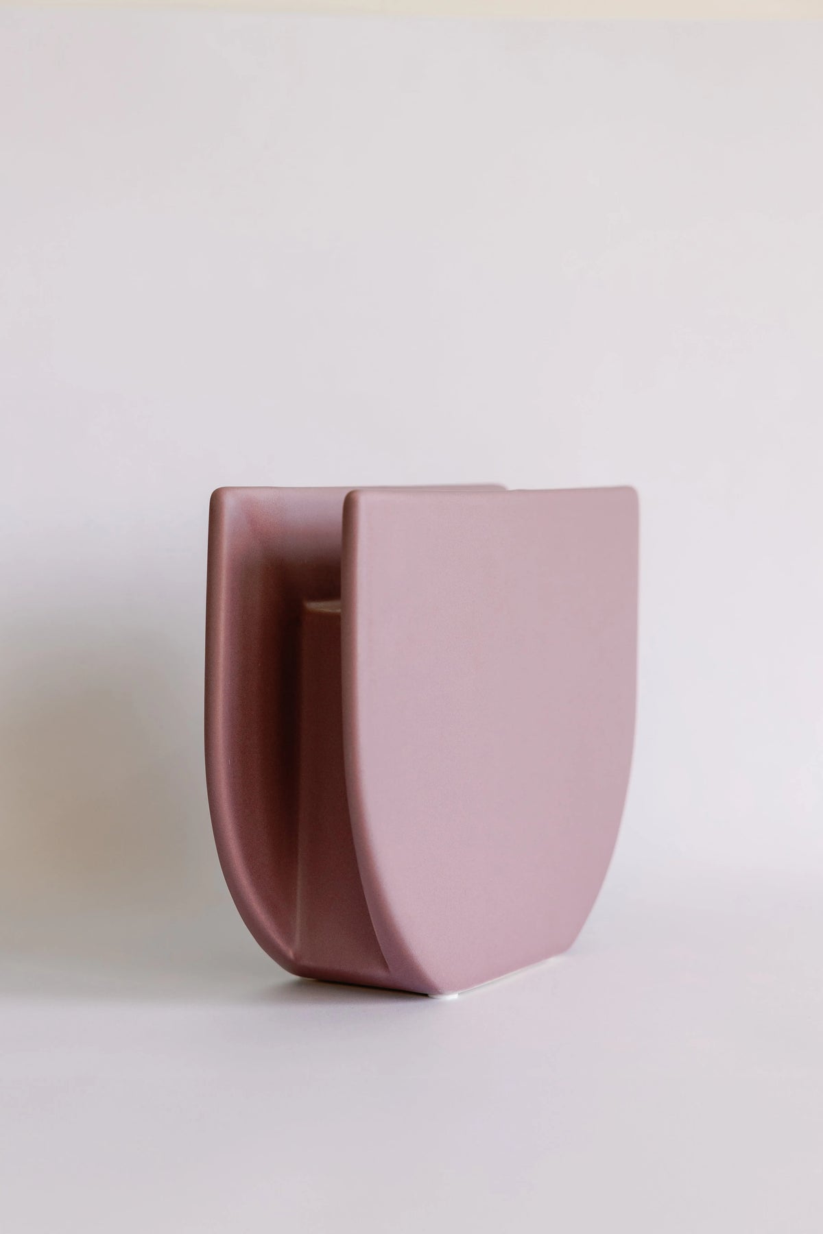 Sunrise ceramic vase angled to show its dual-panel form, mauve front layered over deeper rose back