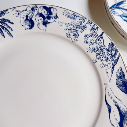 White plates with blue floral patterns on a white background