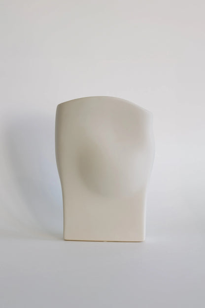 Wave ceramic vase in matte cream, sculptural draped form with curved top, front view