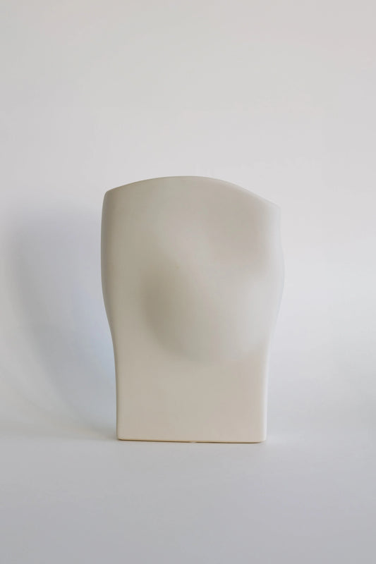 Wave ceramic vase in matte cream, sculptural draped form with curved top, front view